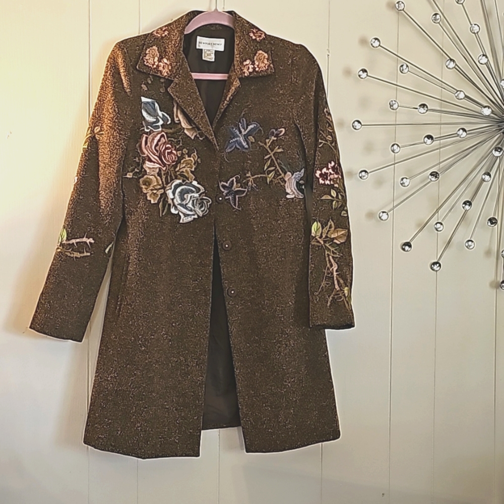 Tan brownish designer jacket made by Newport News Smalls to medium size